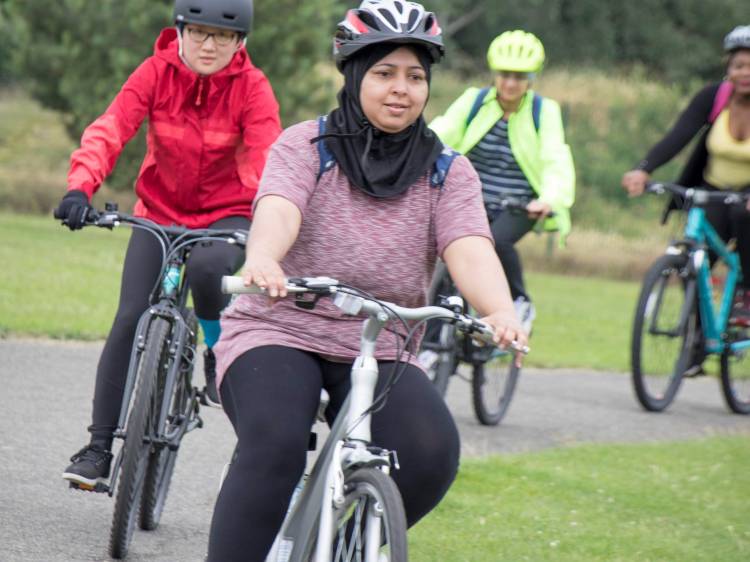 Photograph of adults learning basic skills
