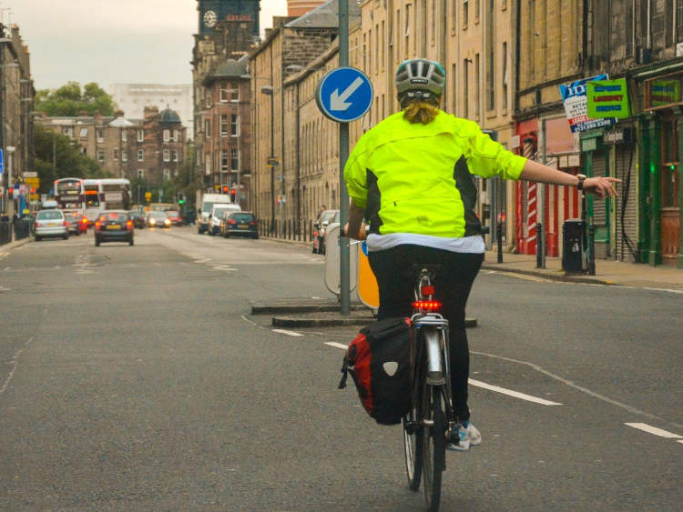 Photography of cyclist signalling