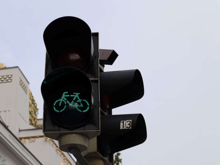 Photograph of traffic lights showing green cycle symbol